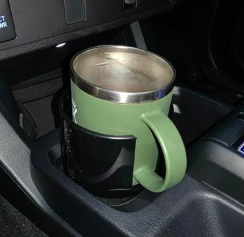 A customer review photo with the cupholder adapter inside a cupholder with a handled mug.