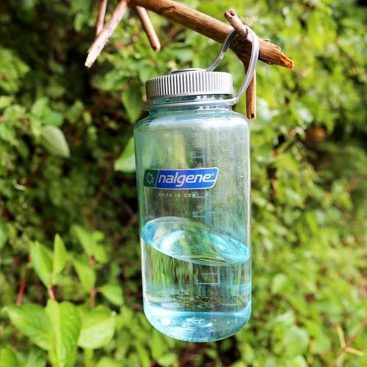 clear bottle with a silver cap 
