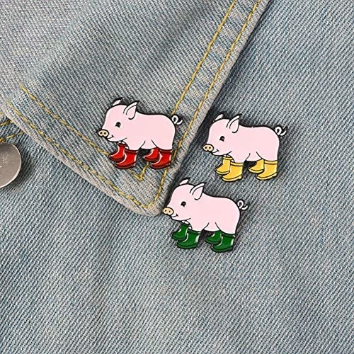 denim lapel with three enamel pins of pigs wearing colorful rainboots