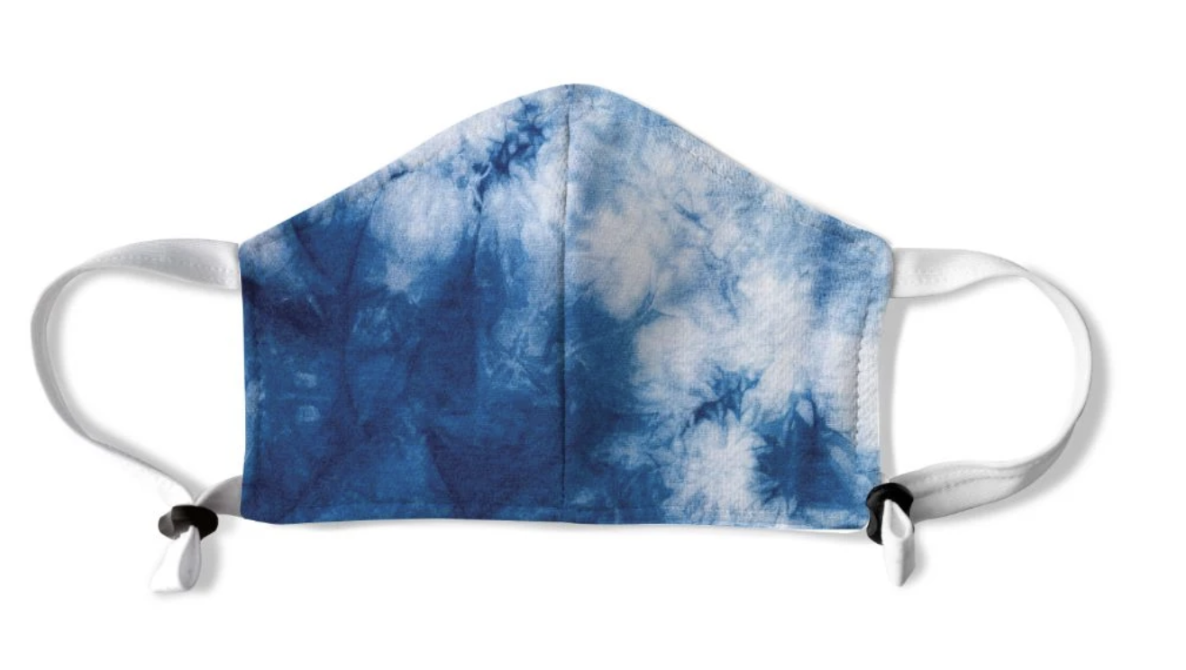 A blue tie-dye face mask 