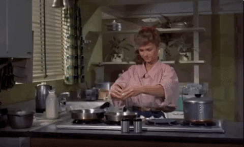 debbie reynolds in the movie "susan slept here" cracking an egg and throwing the shell over her shoulder
