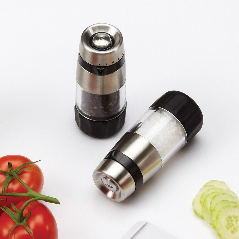 the salt and pepper grinders: the bottoms are black, the area where the seasoning is held is clear, and the tops are stainless steel