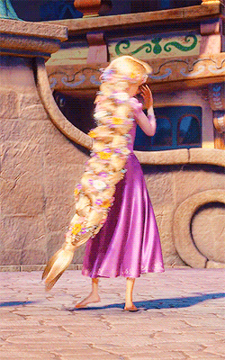 Gif of Rapunzel from Tangled swirling in her dress in the sunlight