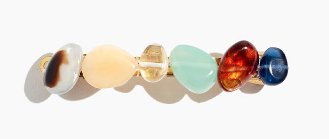 A rectangular hair barrette with little stones in different colors 