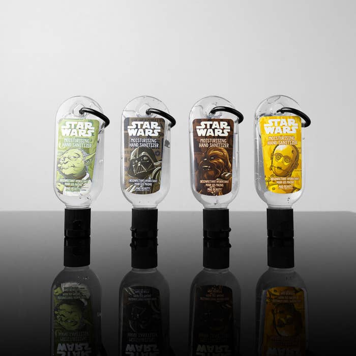 A row of mini hand sanitizers with keychain loops