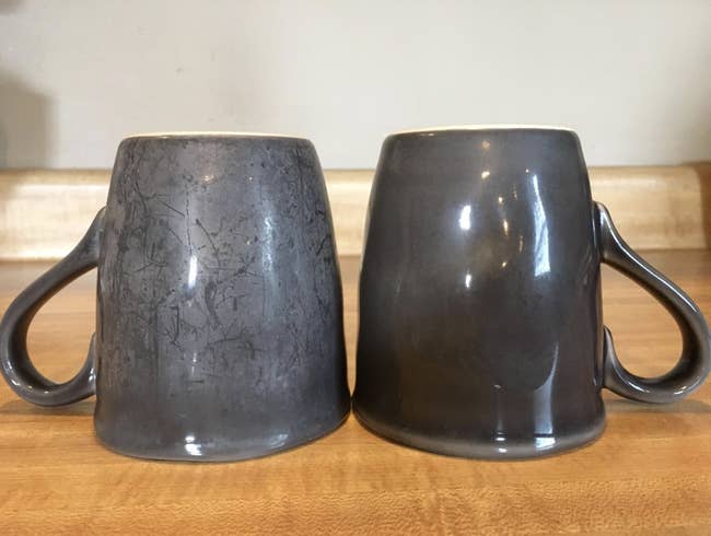 A hard water stained mug and a totally clean version of it sitting on a counter together 