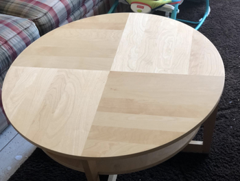 Clean wooden table after using cleaning sponges
