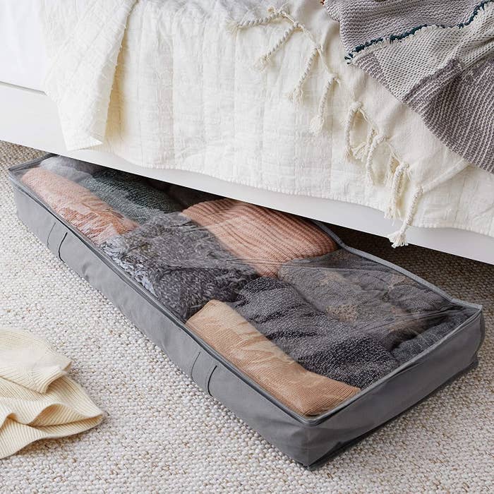 Storage bag with clothes under bed 