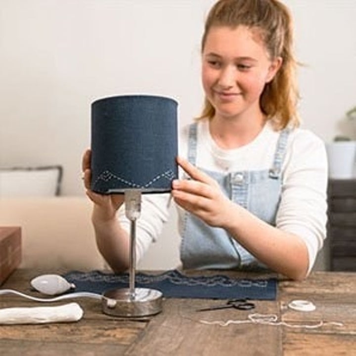 A teen model building a lamp 