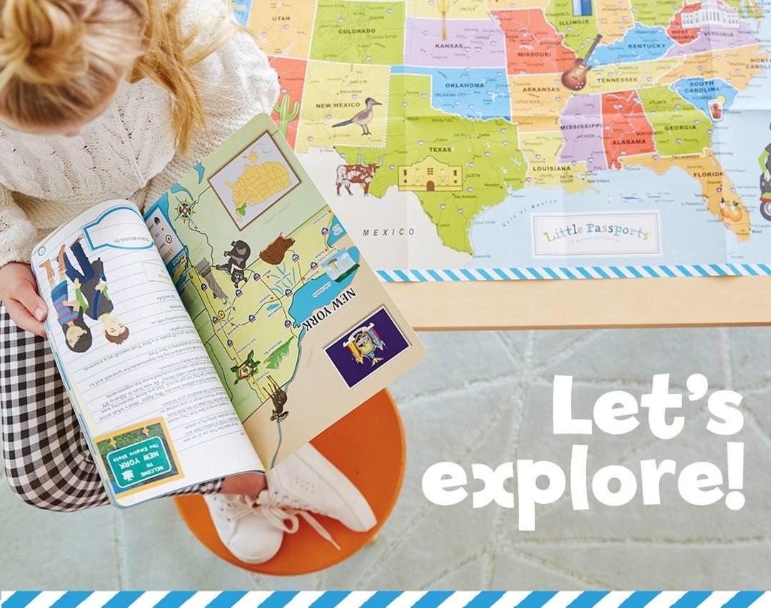 A child model reading a world-explore book with a map of the United States behind them