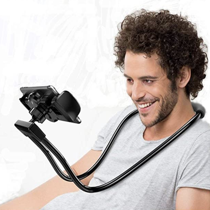 Model with neck mount around head watching something on a phone 