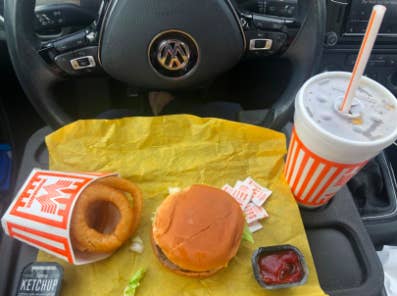 tray that cilps onto steering wheel with enough room for a fast food meal 