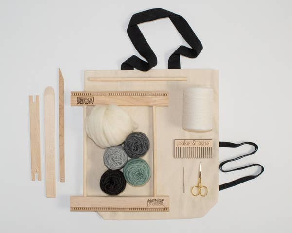 weaving kit with contents laid out on tote bag
