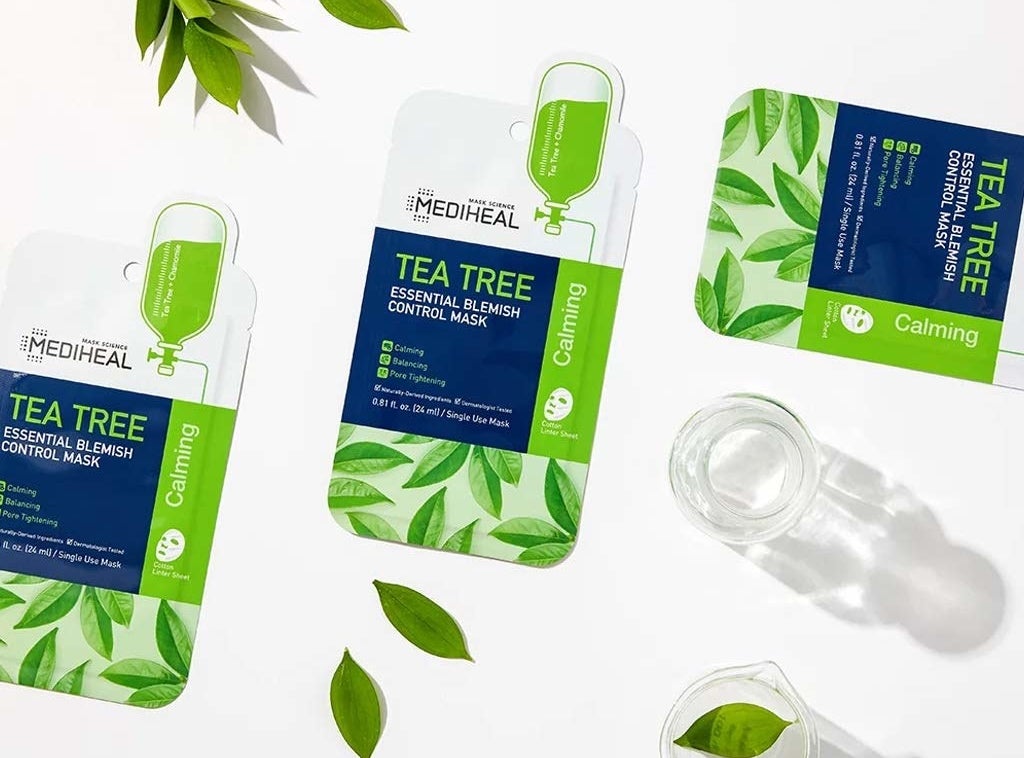 three green, blue, and white mask packets labeled &quot;Mediheal tea tree essential blemish control mask&quot; 