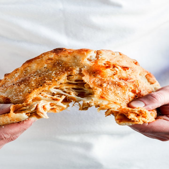 Buffalo Rotisserie Chicken Calzone broken apart
