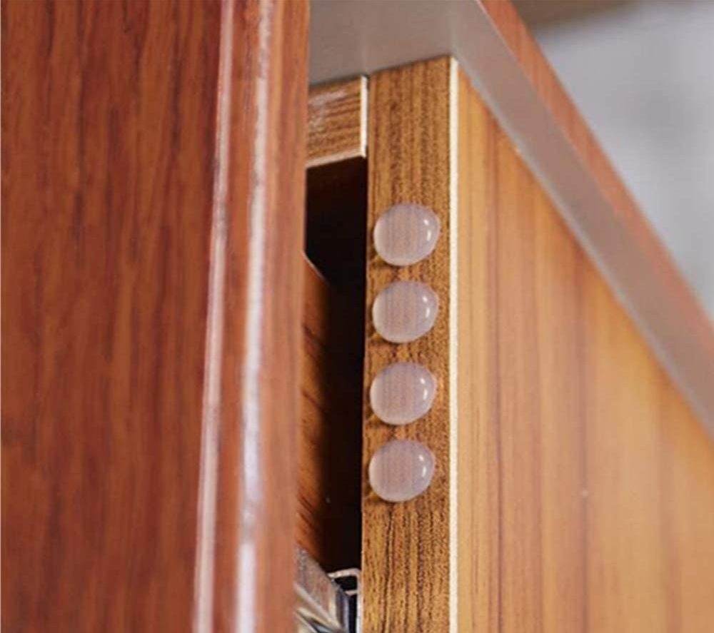 open cabinet door with the bumper on the edge of the cabinet door