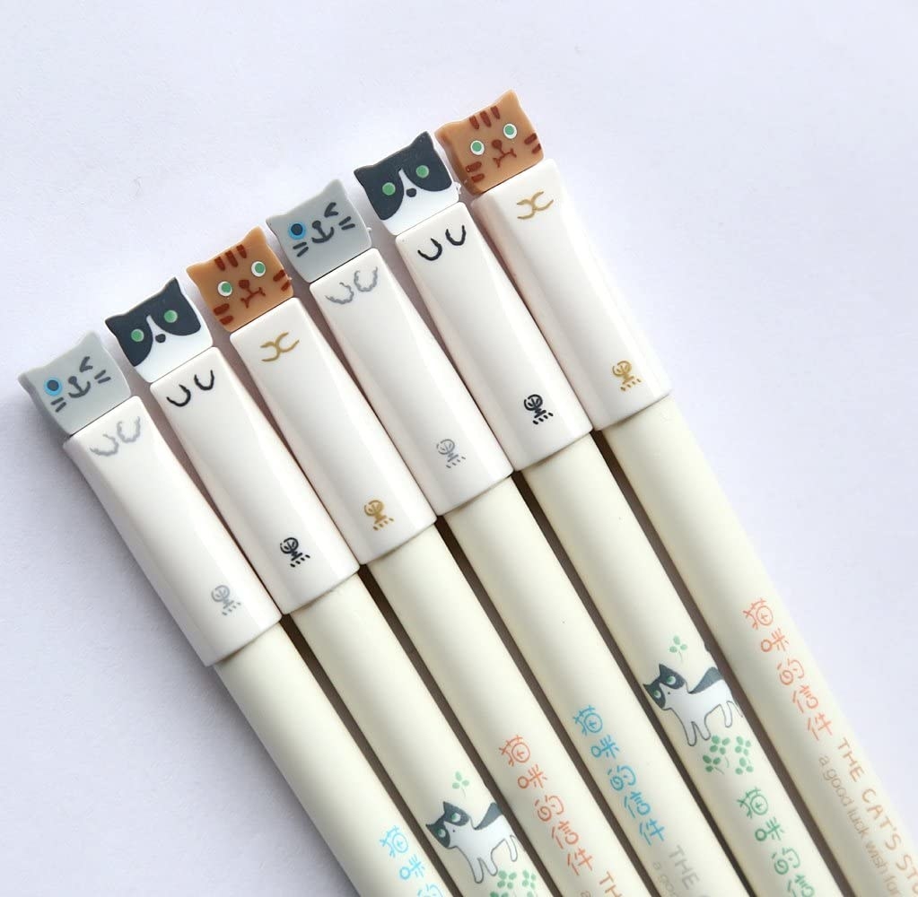 The pens, which have caps that look like cats
