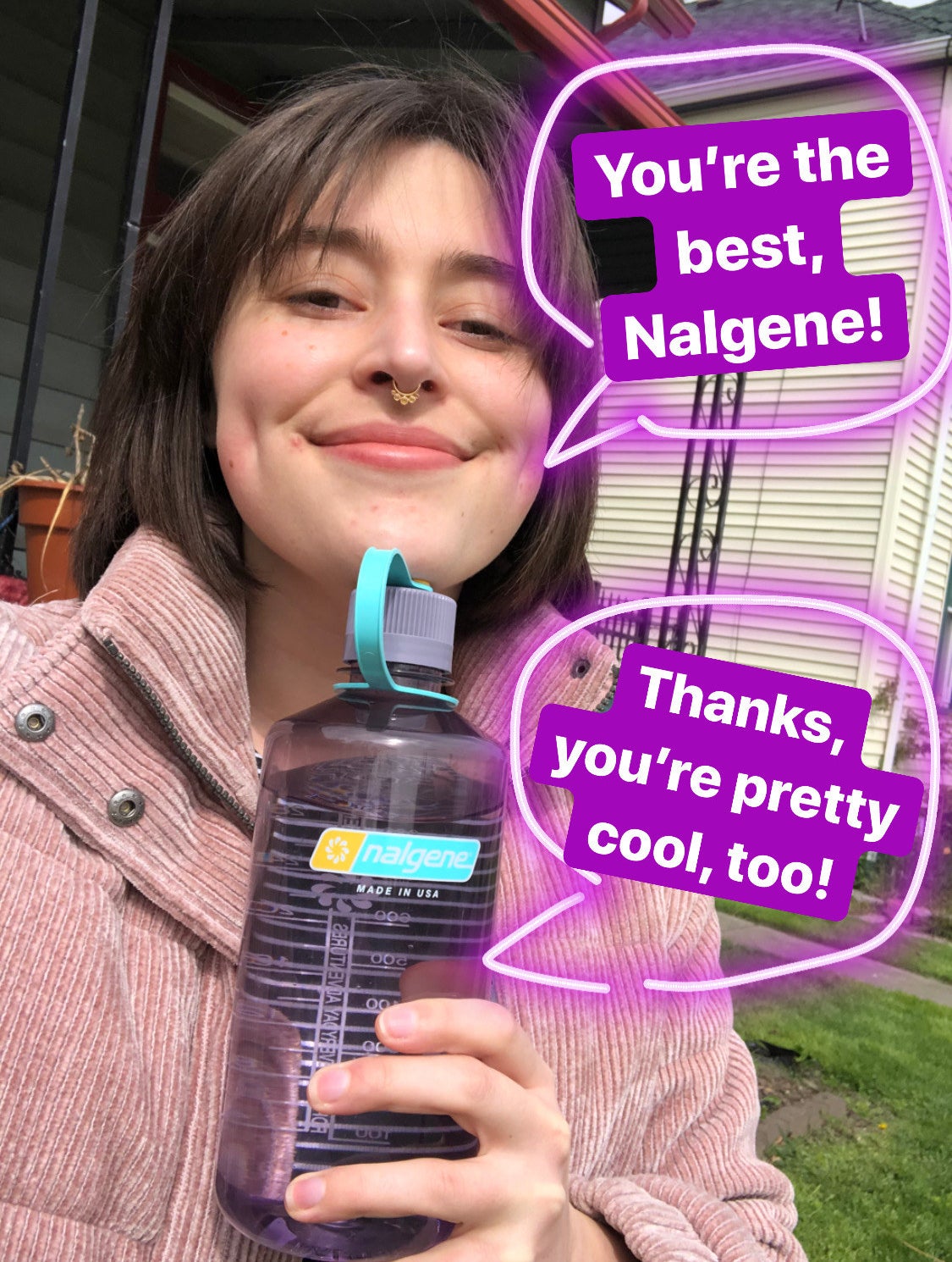 A person smiling and holding a large water bottle