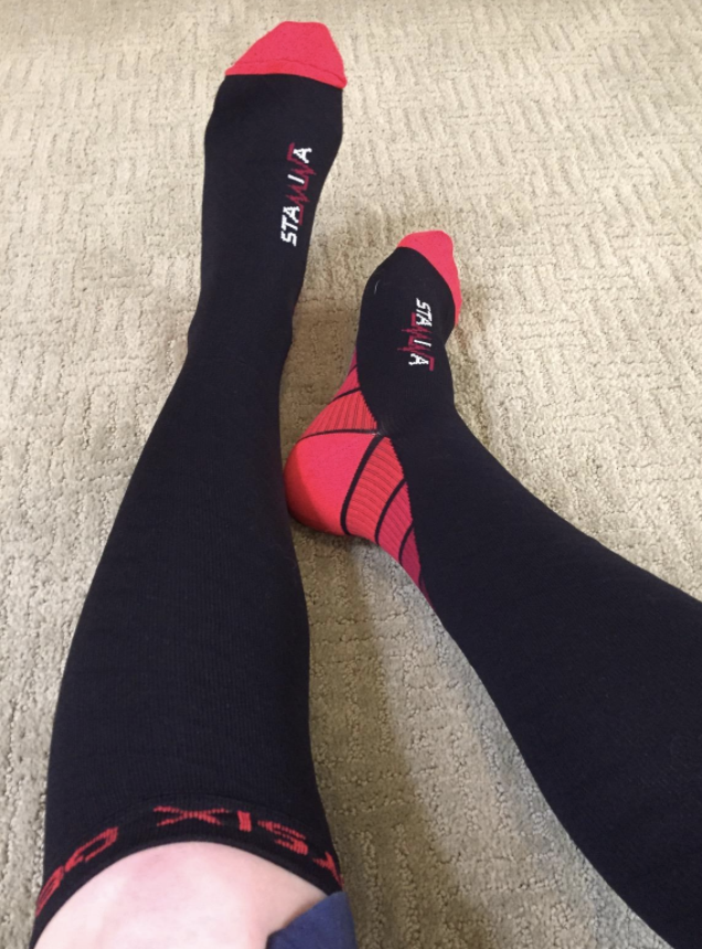 black and red compression socks on reviewer&#x27;s legs