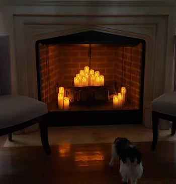 Reviewer photo of the candles in their fireplace