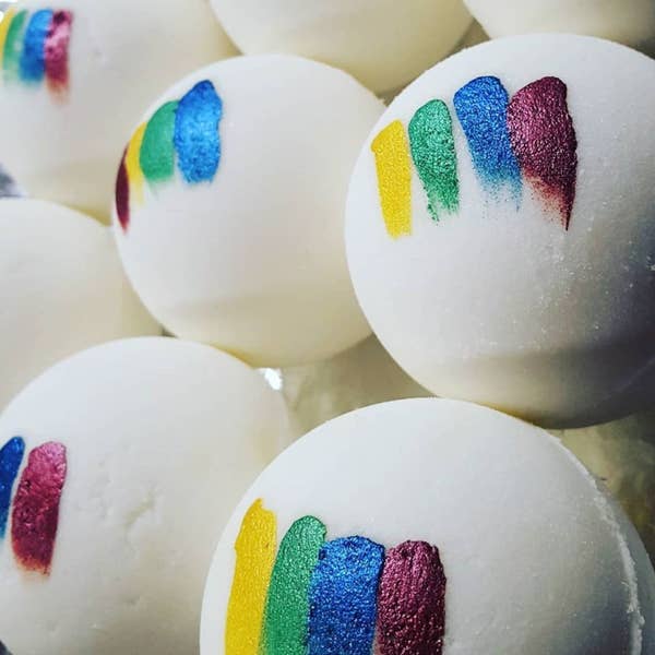 A cluster of bath bombs with Hogwarts house colors on them 
