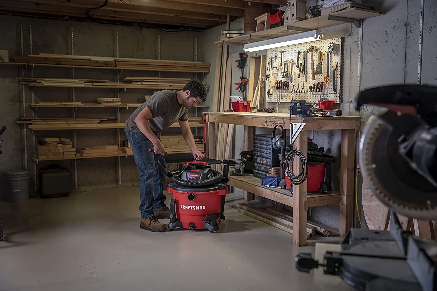 A idiosyncratic   lasting  successful  beforehand   of a workbench operating a wet-dry vacuum