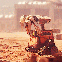 A gif of the robot Wall-E from the Disney movie Wall-E wearing a bra on his eyes