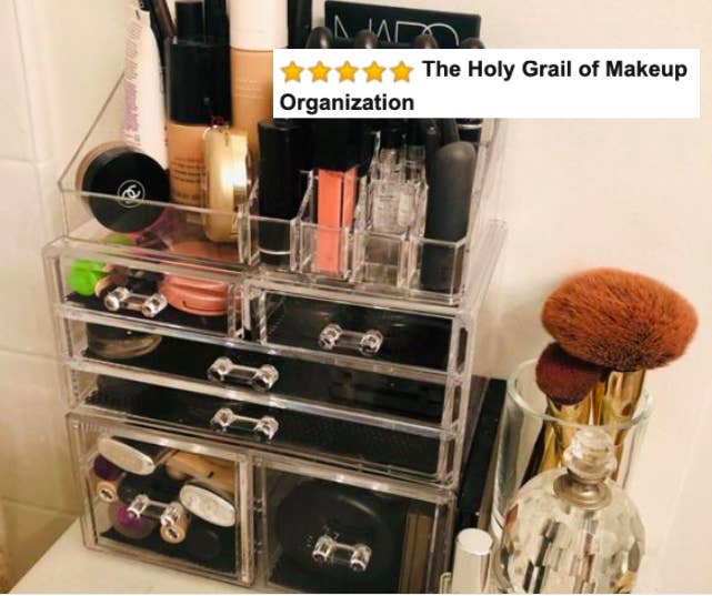The clear cosmetic organizer filled with makeup 