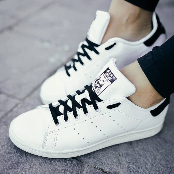 A pair of Adidas with tie-free shoelaces on them