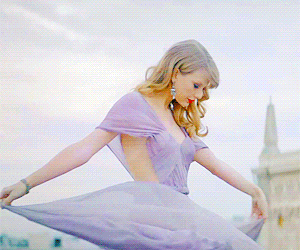 Taylor Swift spinning in a dress