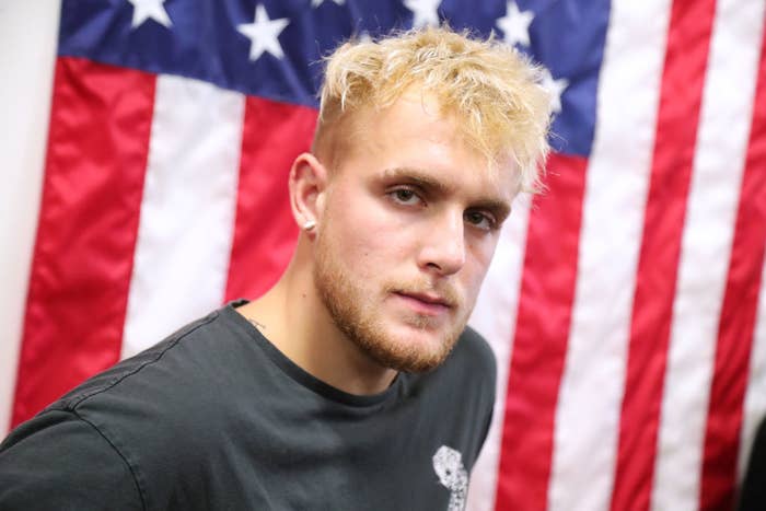 YouTube star Jake Paul in front of a United States flag.