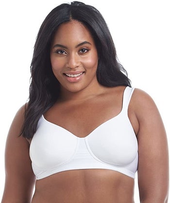 Curvy model wearing the bra in white. The bra has a cup design.