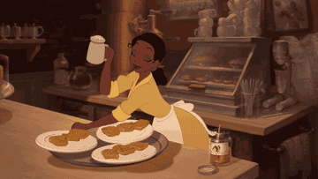 Tiana from The Princess and the Frog preparing food at her restaurant.