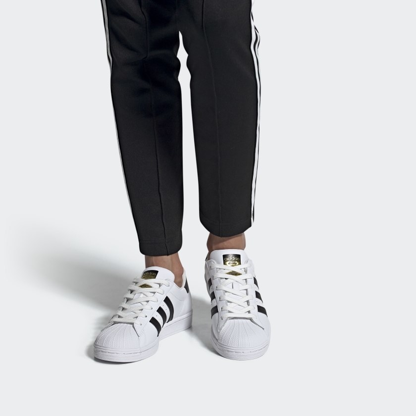 adidas superstar shoes with three black stripes on either side
