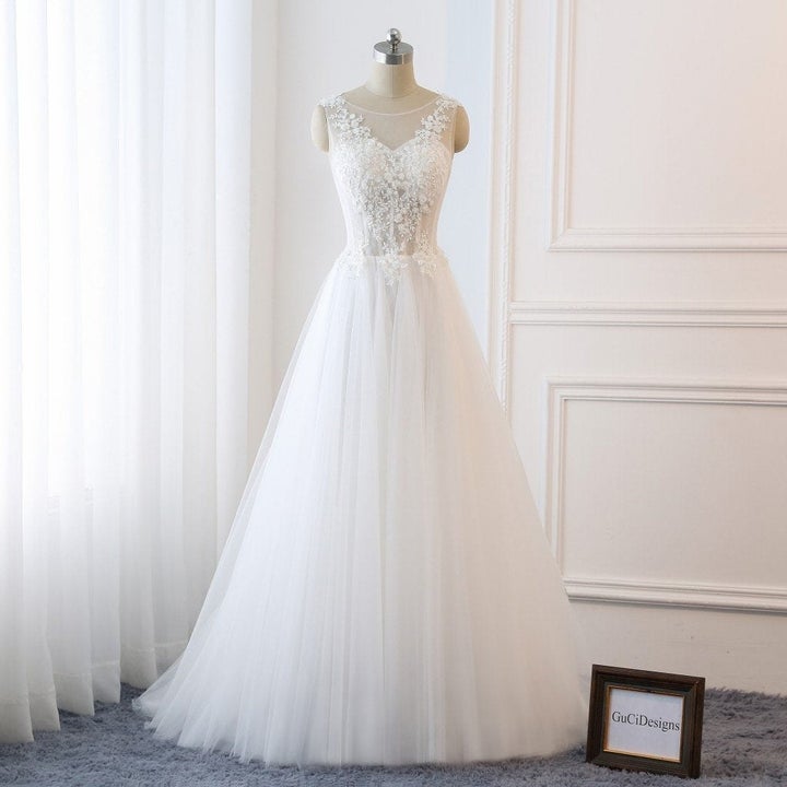 a white ball gown on a mannequin with a lace sweetheart neckline