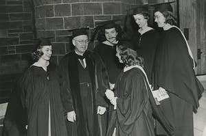 Students gather around former Chatham President Spencer before graduation