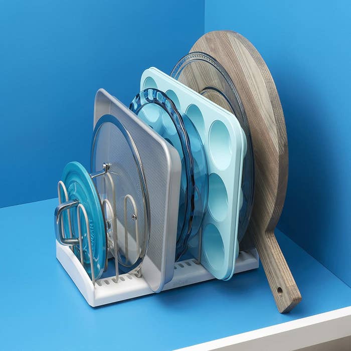 The lid rack holding various pans and lids to keep them separated 