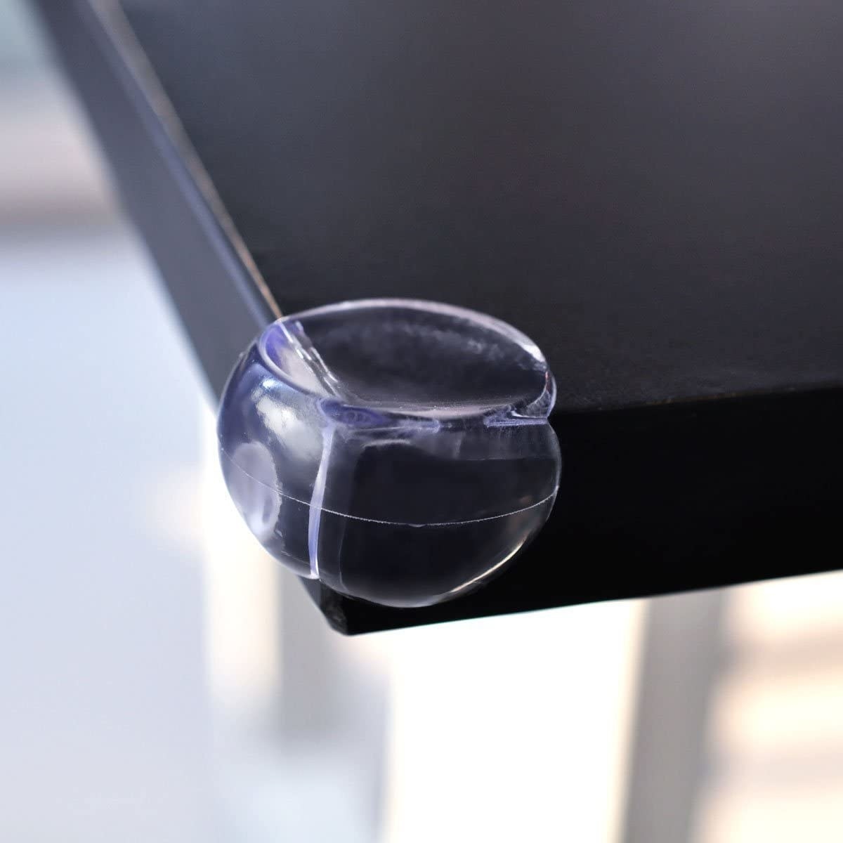 A close-up shot of the transparent corner protector on the edge of a table