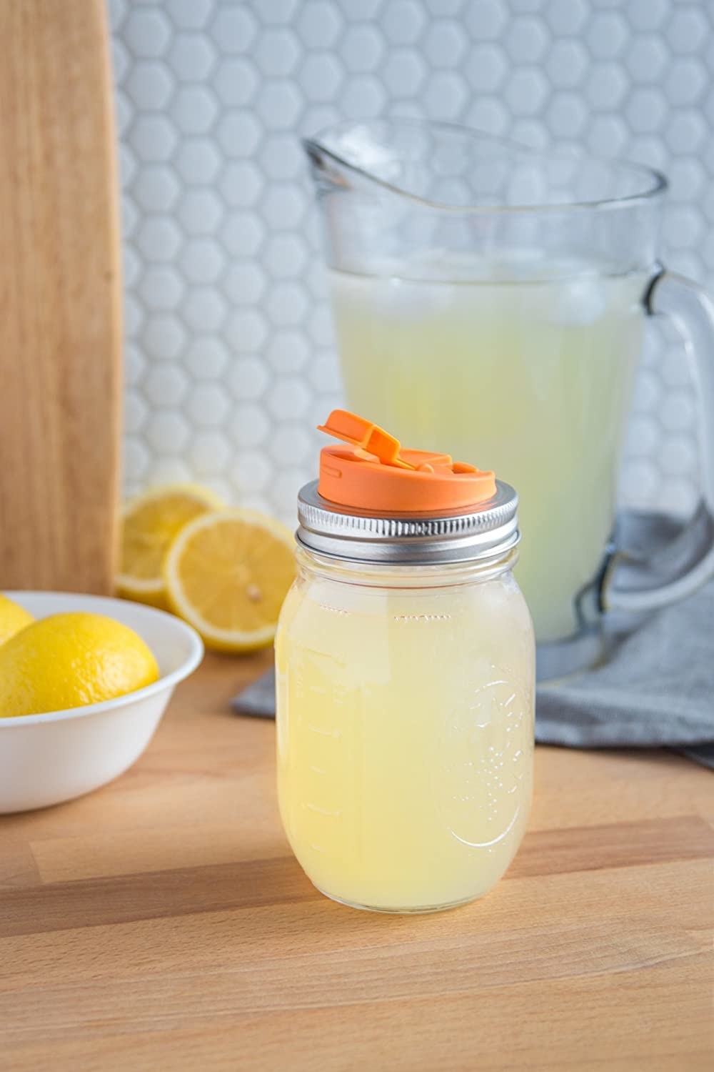 The lid is attached to a Mason jar full of lemonade