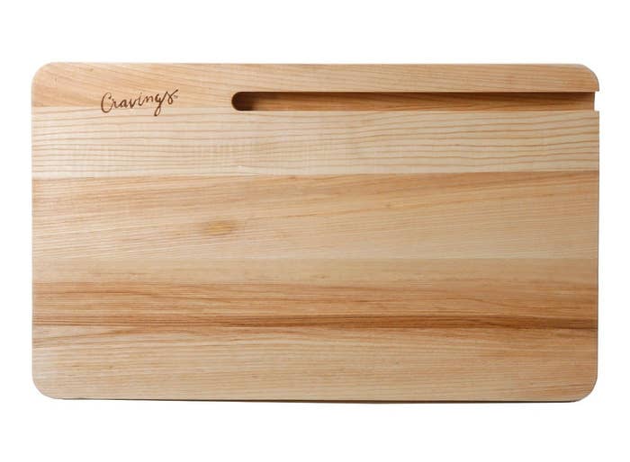 The cutting board with the slot in the top right corner and the word &#x27;Cravings&#x27; in the top left