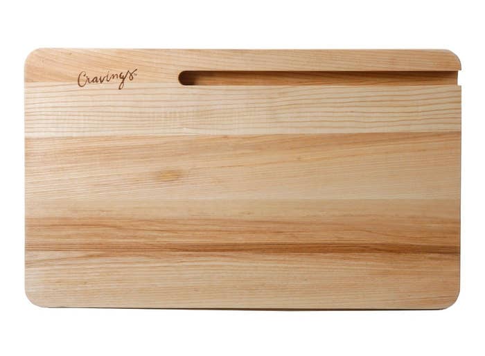 The cutting board with the slot in the top right corner and the word 'Cravings' in the top left