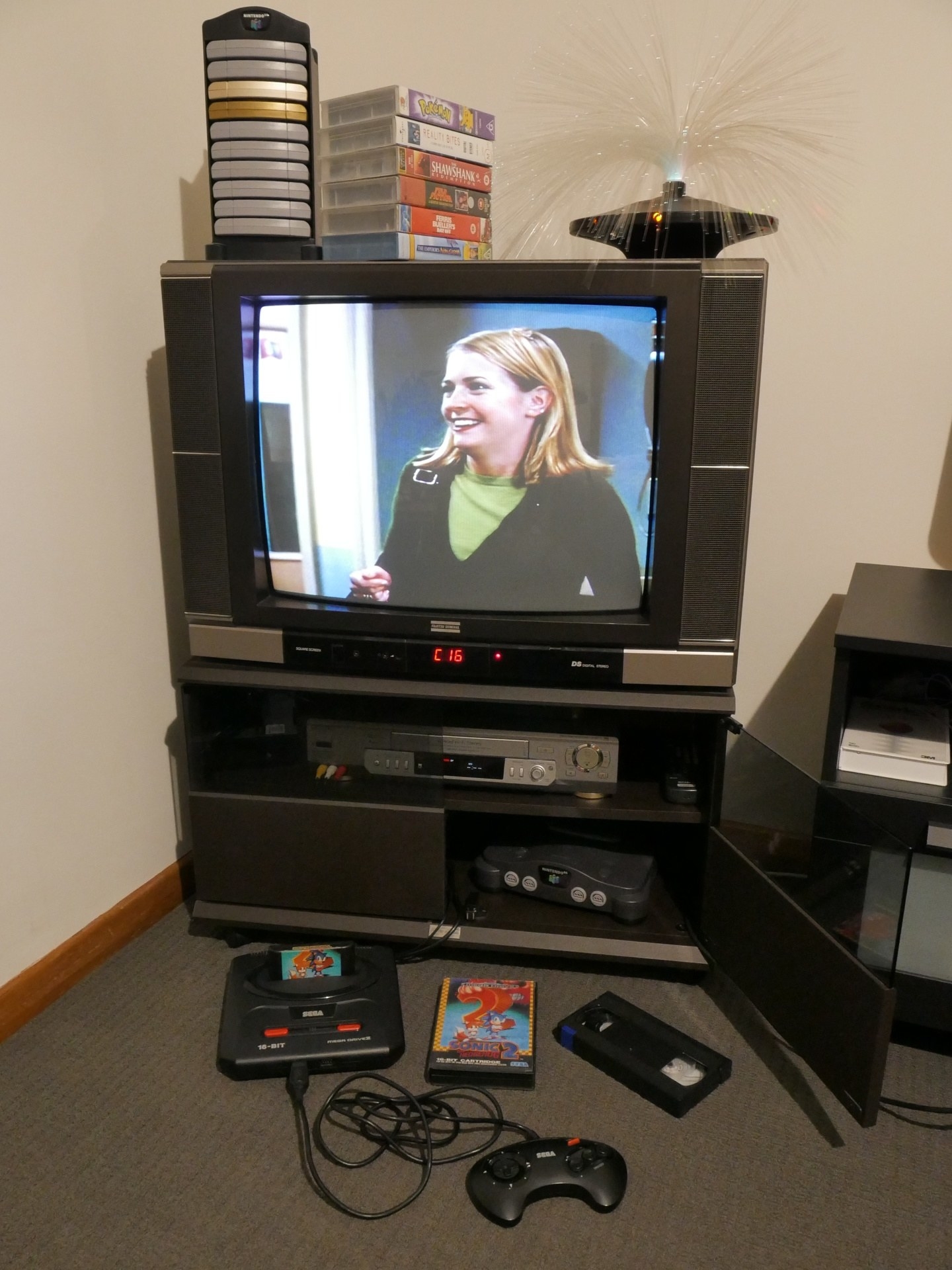 TV on cabinet with an old &#x27;90s TV on it and playing Sabrina the Teenage Witch