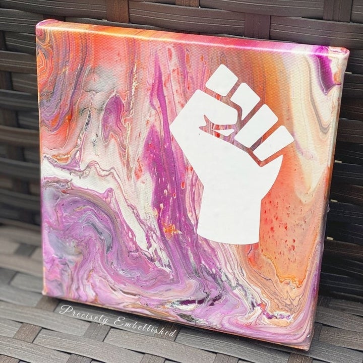 pour over swirl art with the Black Lives Matter fist