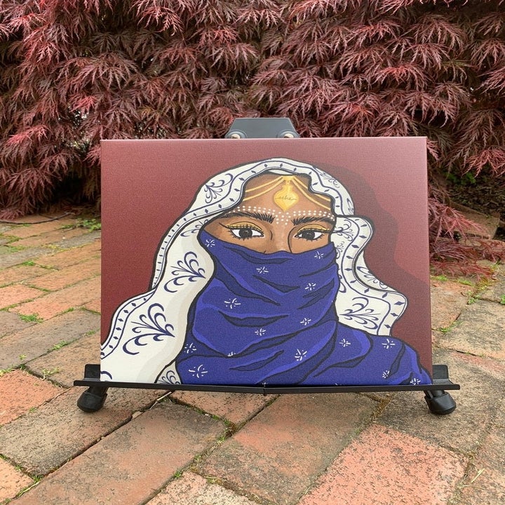 canvas painting of beautiful person with hair and lower half of face covered