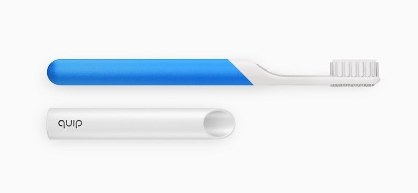 A thin electric toothbrush with a blue handle and cover with brand logo