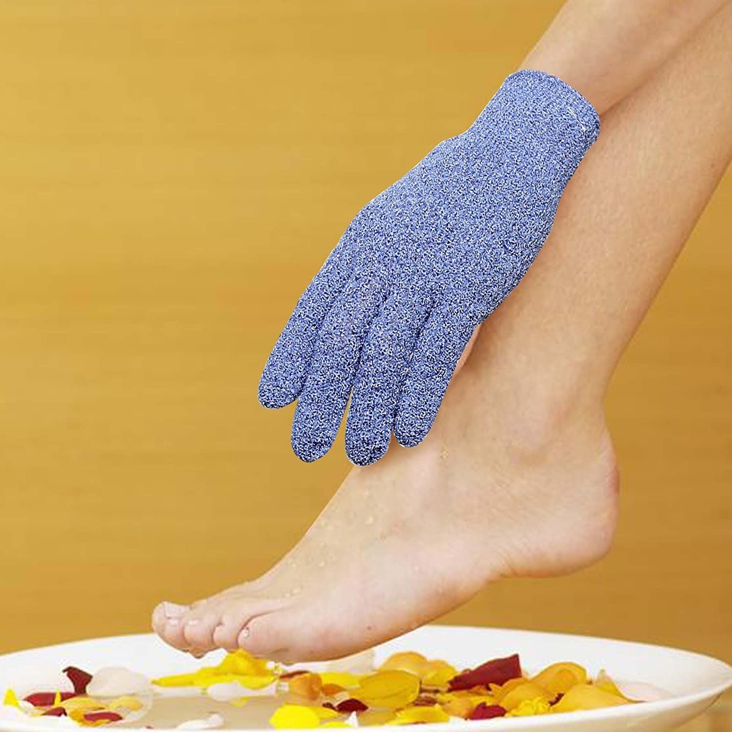 A person scrubbing their leg with a shower glove