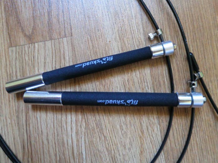 Black jump rope with Fit Skaud-branded, stainless steel handles