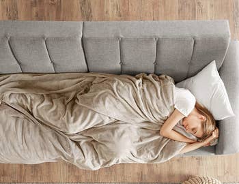 A person sleeping with the Degrees of Comfort weighted blanket