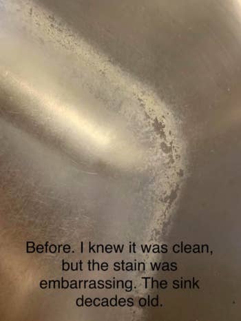 A reviewer's sink with stains along the inner edges, with the text 