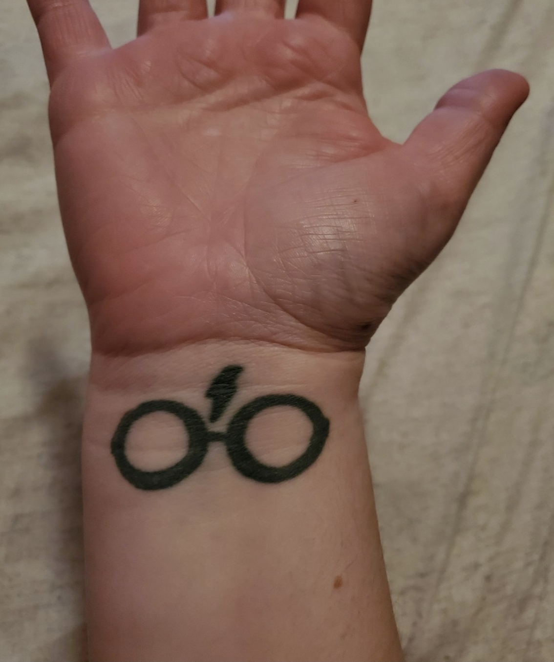 Finn H.&#x27;s tattoo of Harry Potter&#x27;s glasses and scar